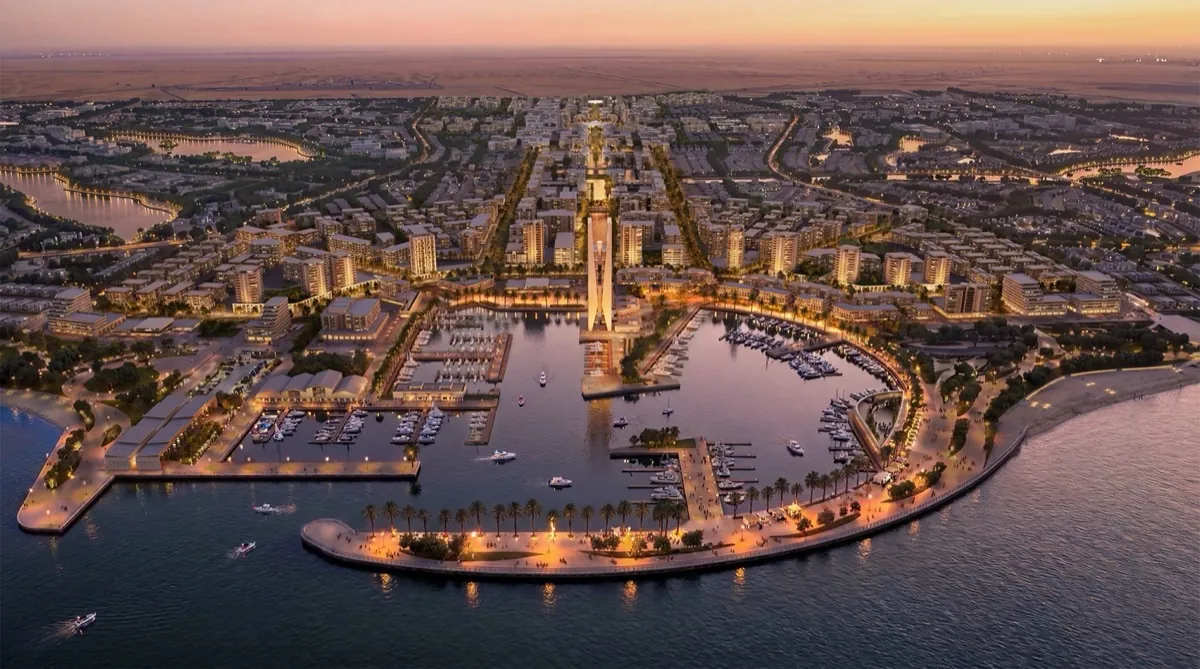 Alam El Roum Marsa Matrouh marina aerial view Aerial rendering of Alam El Roum at dusk showing a crescent-shaped marina lined with buildings in Marsa Matrouh