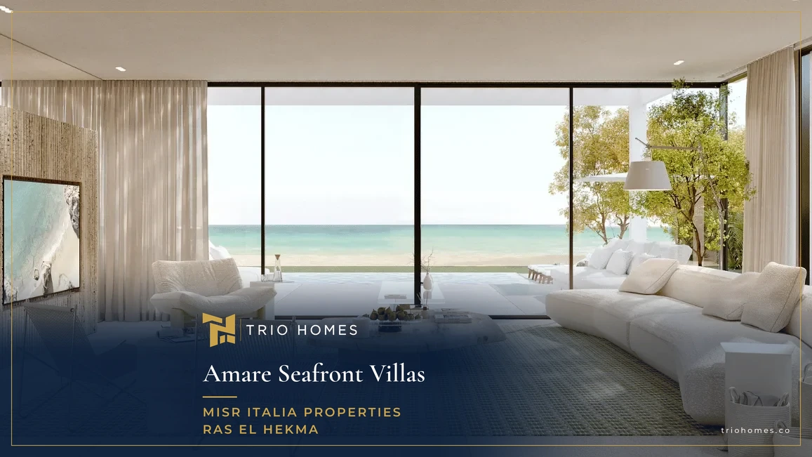 Living room with a full-height window and sea view in an Amare Seafront Villas Ras El Hekma villa Living room with a full-height window and sea view in an Amare Seafront Villas Ras El Hekma villa