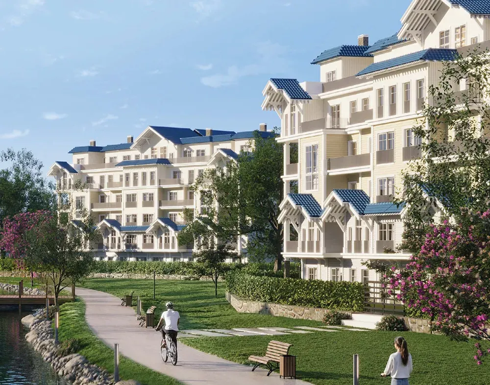 Rendering of classic-style apartment buildings with a cycling path and gardens at CreekView by Mountain View