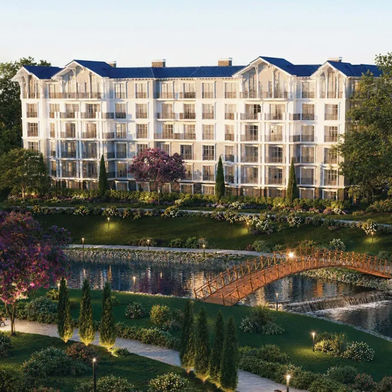 Rendering of a residential building overlooking a water feature and footbridge at CreekView, New Cairo