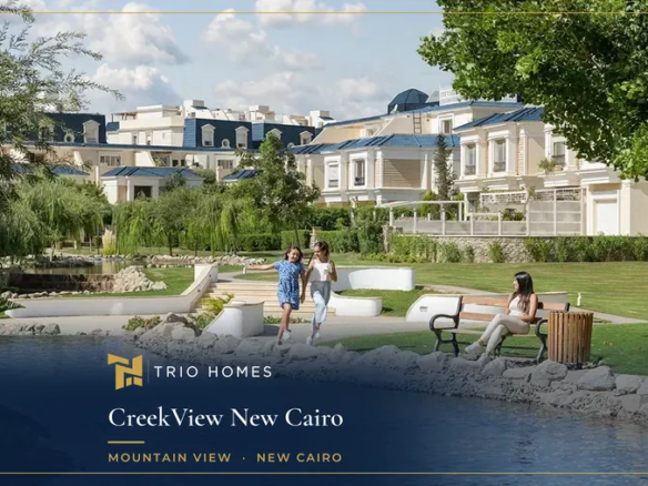 Rendering of a landscaped creek with gardens and residential buildings in the background at CreekView, New Cairo