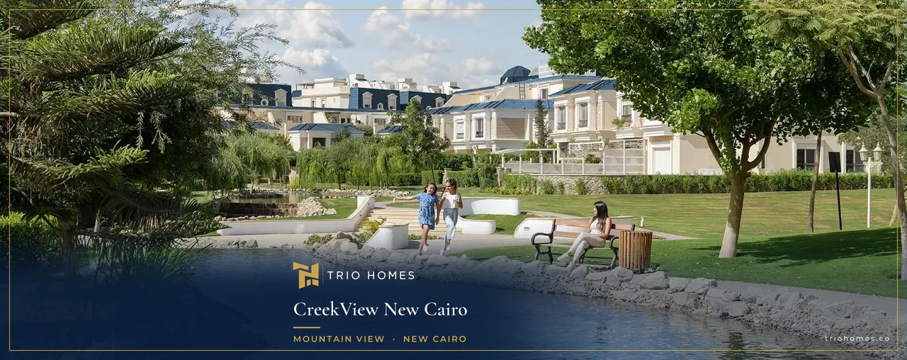 Rendering of a landscaped creek with gardens and residential buildings in the background at CreekView, New Cairo