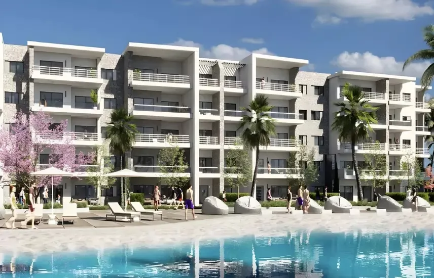 DOSE Al Dabaa apartment buildings and pool Rendering of white low-rise apartment buildings overlooking a pool deck at DOSE by Akam Alrajhi