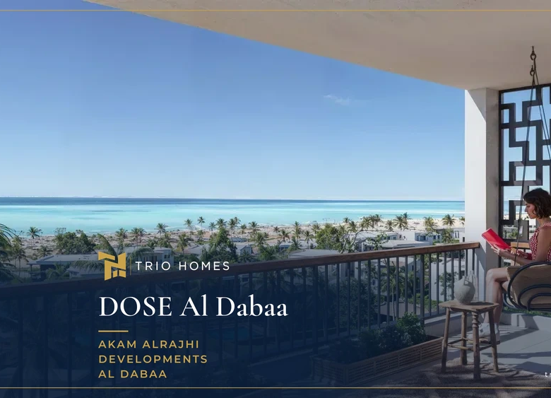 Woman relaxing on a balcony overlooking pools, green areas and the sea at DOSE, North Coast