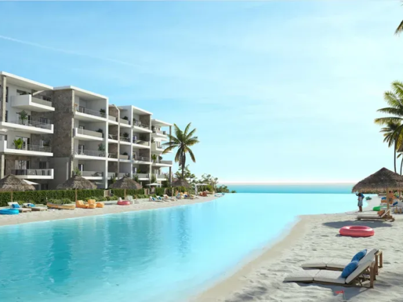Rendering of a sandy lagoon beach with sun loungers and residential buildings at DOSE, Al Dabaa