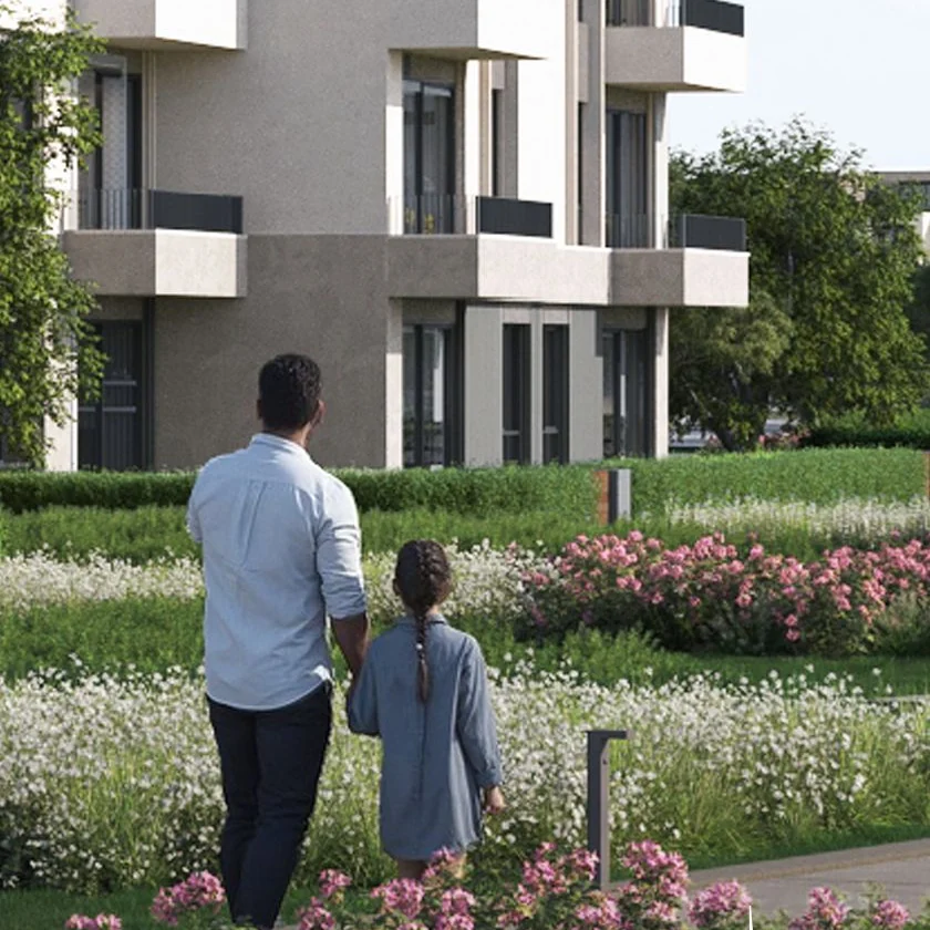 gardinn-solana-east-new-cairo-landscaped-gardens Flower-lined gardens in front of an apartment building at Gardinn Solana East New Cairo