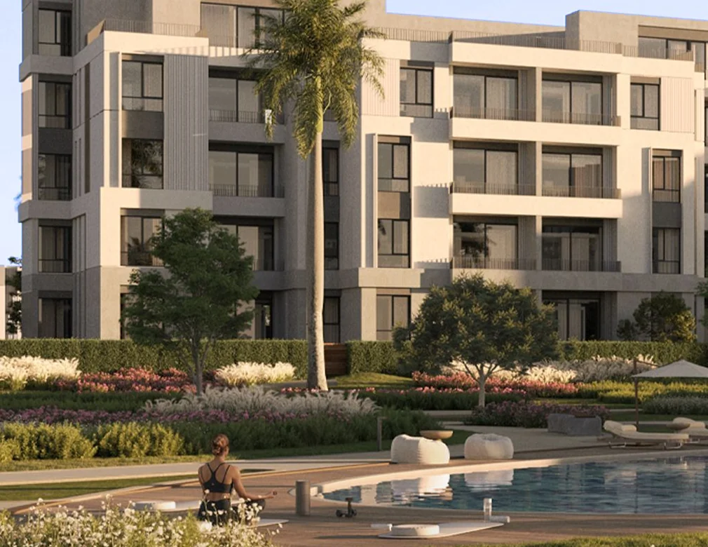 Gardinn Solana East New Cairo low rise buildings pool Low-rise residential buildings beside a landscaped pool at Gardinn Solana East New Cairo