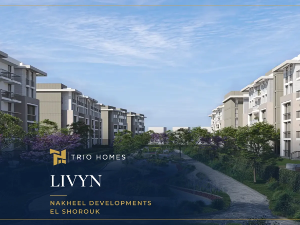 Garden walkway between low-rise apartment buildings at LIVYN El Shorouk