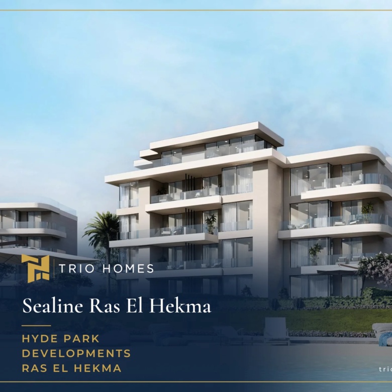 Lagoon beach with sunbeds in front of residential buildings at Sealine Ras El Hekma