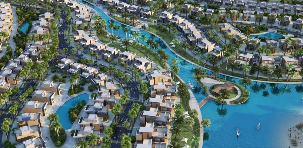Sarai New Cairo aerial view of villas and lagoons Aerial rendering of Sarai, New Cairo showing villa clusters set around lagoons and green spaces