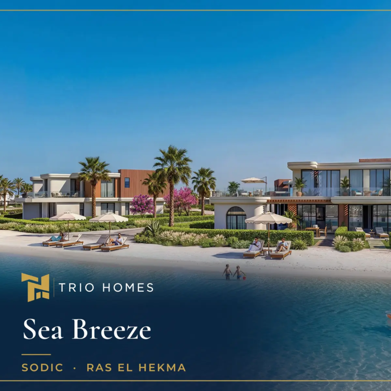 Villas facing a turquoise lagoon with a white sandy beach, sunbeds and kayaks at Sea Breeze, Ras El Hekma