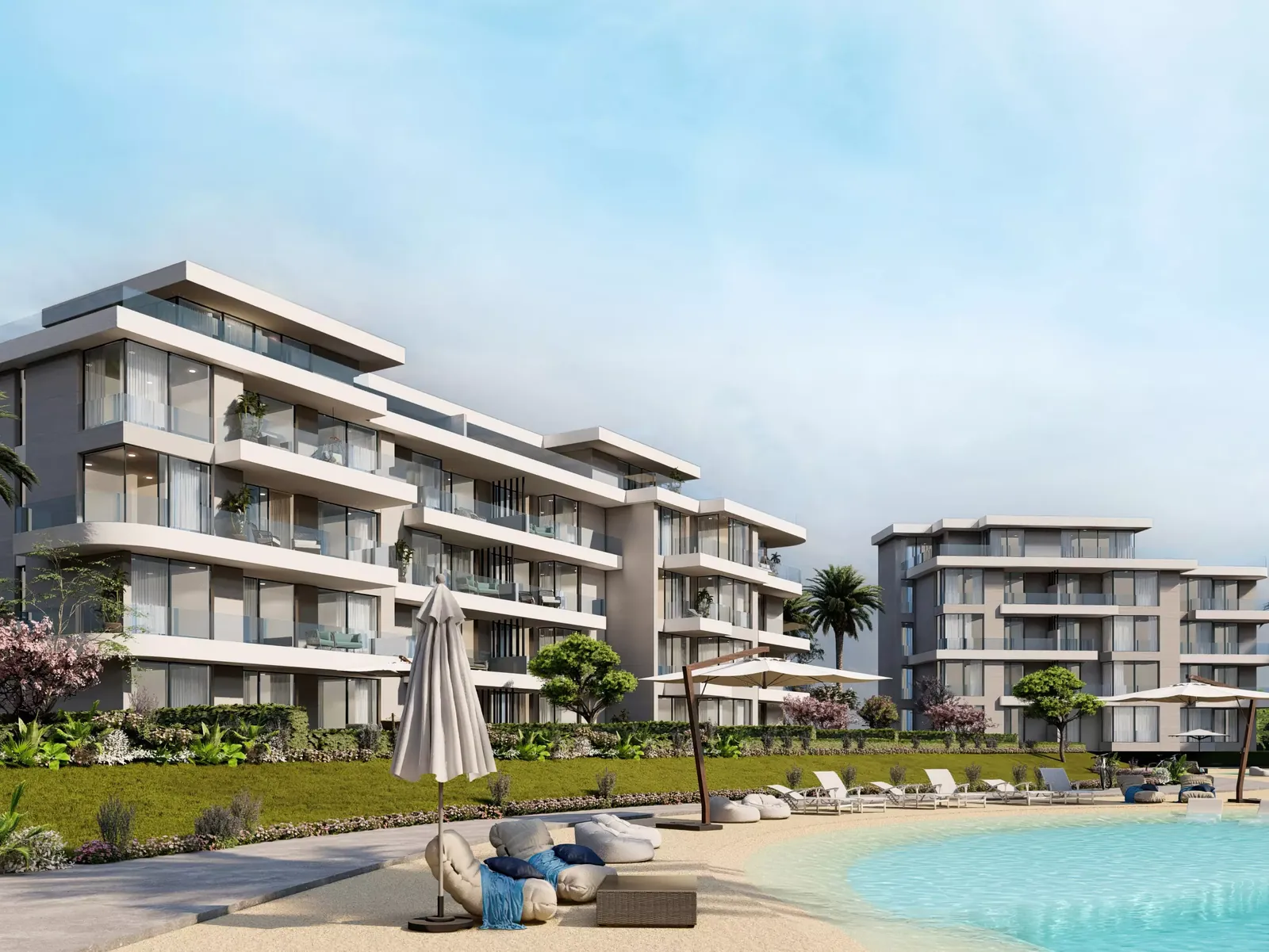 Seashore Ras El Hekma buildings by the lagoon Rendering of low-rise residential buildings beside a lagoon beach at Hyde Park's Seashore community, Ras El Hekma