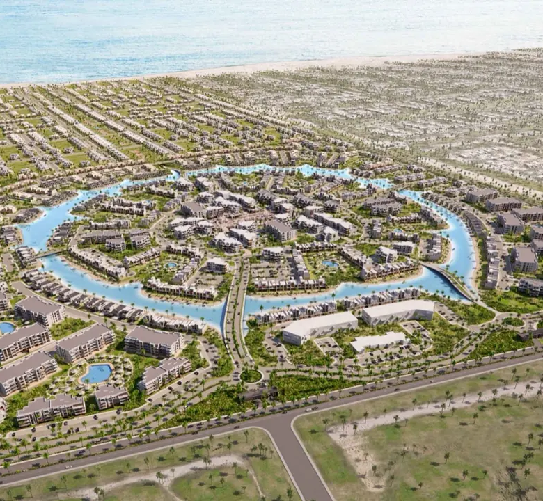 Aerial rendering of Silversands by Ora Developers showing low-rise homes arranged around a circular lagoon
