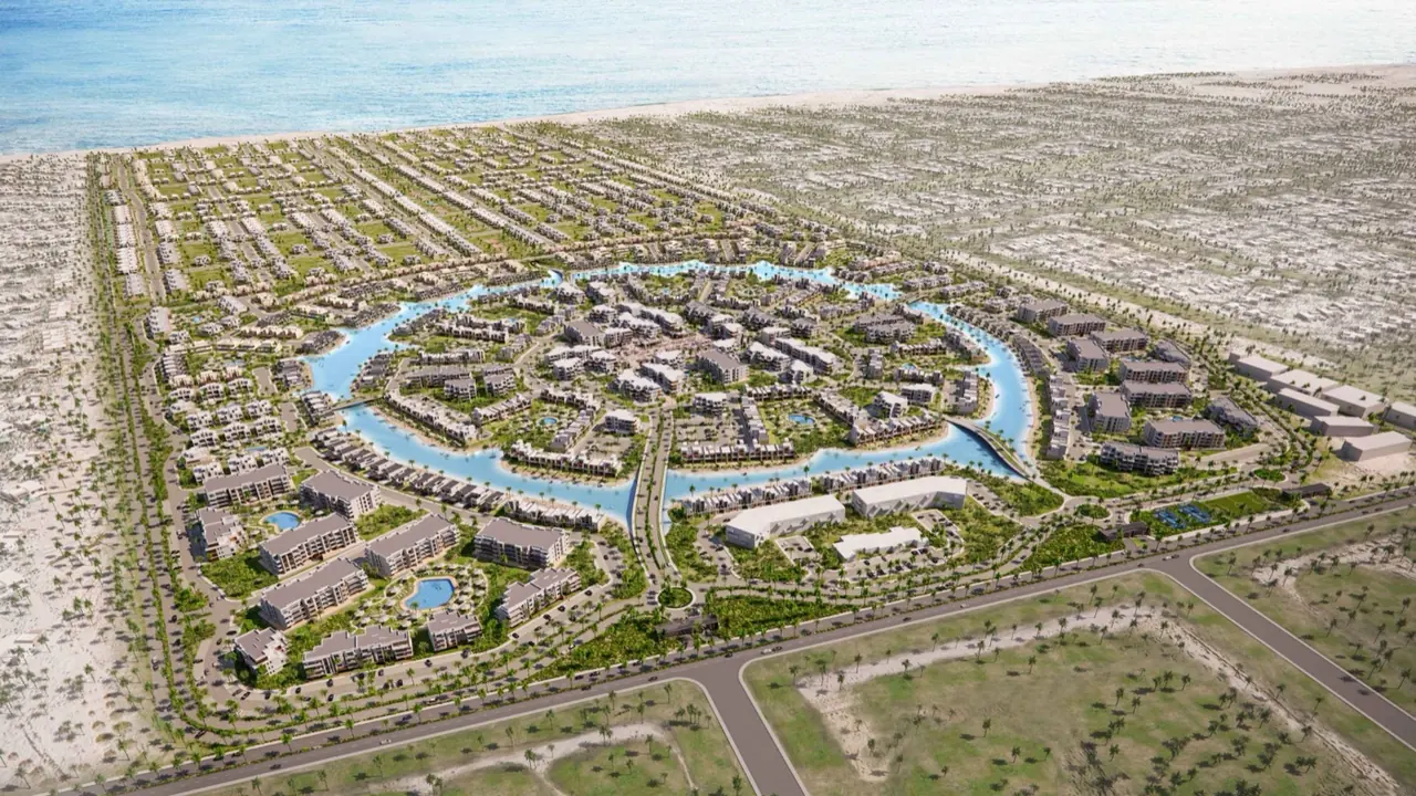Silversands North Coast aerial view Aerial rendering of Silversands by Ora Developers showing low-rise homes arranged around a circular lagoon