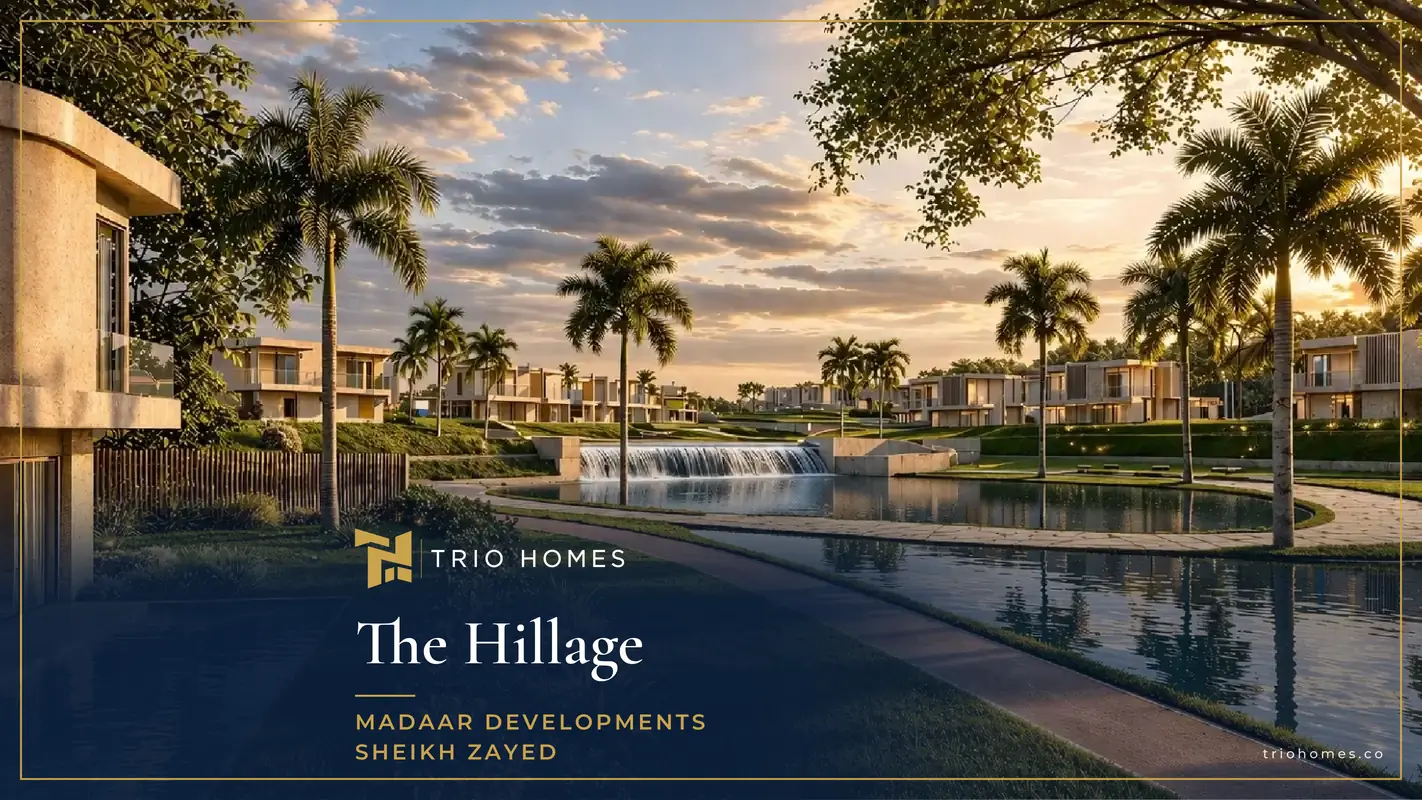 Lagoon and waterfall at sunset with homes behind at The Hillage Sheikh Zayed Lagoon and waterfall at sunset with homes behind at The Hillage Sheikh Zayed
